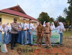 Polsek Kuantan Hilir Laksanakan Program green Policing di SMKN 1 Kuantan Hilir